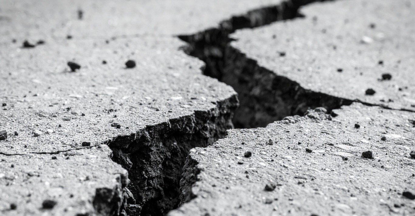 Cracked concrete surface requiring professional repair services