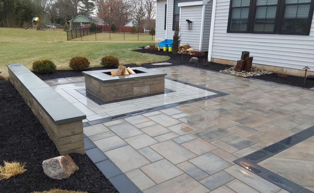 Elegant stamped concrete patio with custom fire pit feature